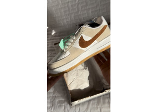 Brown and beige Nike shoes